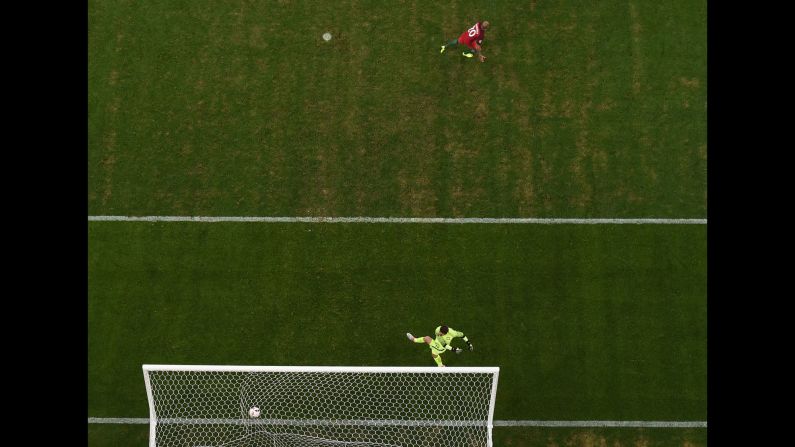 Portugal's Ricardo Quaresma, top, reacts after scoring the penalty that clinched the victory.