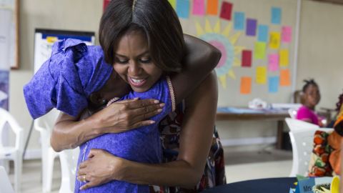 Michelle Obama hugs a student following a lesson plan about girls' leadership and self-esteem in support of the Let Girls Learn initiative, in Kakata, Liberia, June 27. 
