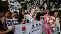 Leung Kwok-hung (3rd L) -- known as "Long Hair" -- of the League of Social Democrats holds a placard of Hong Kong Chief Executive Leung Chun-ying as they attend a rally in Hong Kong on July 1, 2016, on the sidelines of the annual flag raising ceremony to mark the anniversary of Hong Kong's handover from Britain to China.
July 1 is traditionally a day of protest in Hong Kong and also marks the anniversary of the handover from Britain to China in 1997, under a "one country, two systems" agreement.  / AFP / ANTHONY WALLACE        (Photo credit should read ANTHONY WALLACE/AFP/Getty Images)