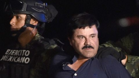 Guzman is escorted into a helicopter following his recapture in 2016.
