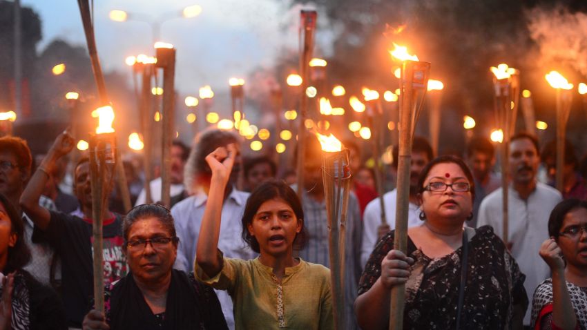 Bangladeshi secular activists take part in a torch-lit protest against the killing of blogger Niloy Chakrabarti, who used the pen-name Niloy Neel, in Dhaka on August 8, 2015.  Dhaka vowed August 8 to hunt down the killers of secular blogger Niloy Chakrabarti who became the fourth such writer to be murdered in Bangladesh by suspected Islamist militants this year. AFP PHOTO/ Munir uz ZAMAN        (Photo credit should read MUNIR UZ ZAMAN/AFP/Getty Images)