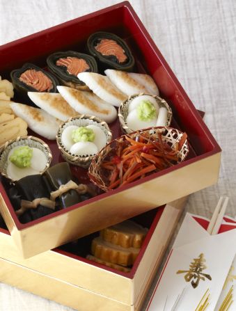 Special dishes eaten during the New Year holidays are collectively called osechi. Arranged in a multi-tiered jubako box, the distinctive menu offers glimpses into Japan's culinary culture. Tiny pieces of shake no kobu maki -- salmon-stuffed kelp rolls -- are included in this one, as seen in the lower left corner of the box. 