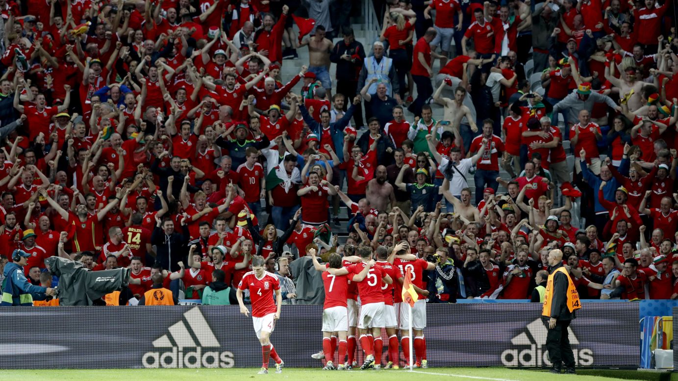 Welsh players celebrate Sam Vokes' late second-half header that gave them a 3-1 victory over Belgium on Friday, July 1. Wales will play in the semifinals against Portugal next week.