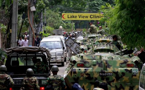 Bangladesh security personnel patrol the streets of Dhaka on Saturday, July 2, after gunmen seized a bakery in the capital overnight, killing 20 hostages and two officers, according to the military.  