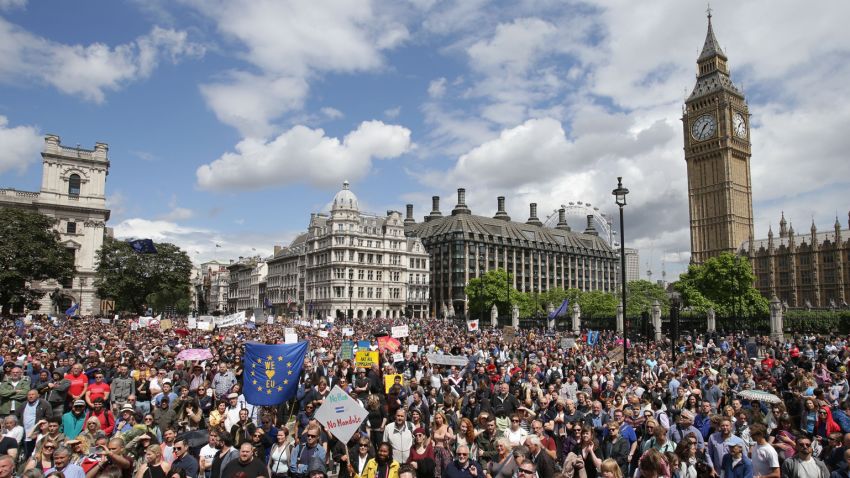 "Remain" supporters demonstrate in Parliament Square, London, to show their support for the European Union in the wake of the referendum decision for Britain to leave the EU, known as "Brexit", Saturday July 2, 2016. Demonstrators wearing EU flags as capes and with homemade banners saying "Bremain" and "We Love EU" gathered on the streets for the March for Europe rally. At rear right is the Elizabeth Tower containing Big Ben. (Daniel Leal-Olivas/PA via AP)