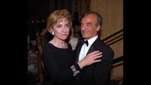 Elie Wiesel stands with then-first lady Hillary Clinton following her acceptance of the Humanitarian Award from the Elie Wiesel Foundation in New York on  April 14, 1994.  