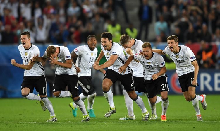 Germany players run to celebrate after Jonas Hector scored to win the game through the penalty shootout in the quarterfinal match against Italy on Saturday, July 2.