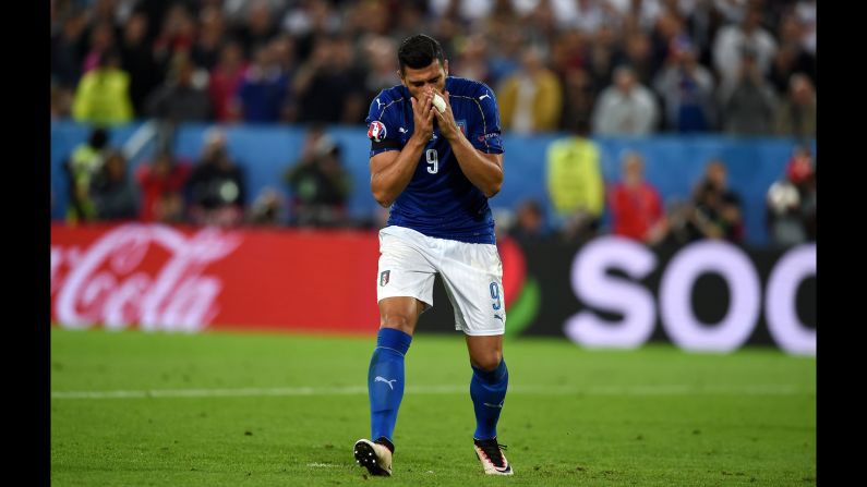 Graziano Pelle of Italy reacts after missing his penalty shot.