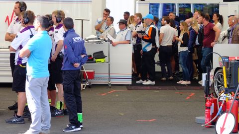 The DS Virgin Racing team watch the action unfold on TV screens in the pit garage. 