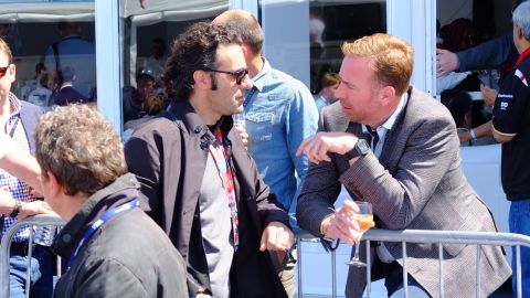 Four-time IndyCar Series champion Dario Franchitti (left) in conversation before Saturday's race. Franchitti works as TV co-commentator on the all electric race series.  
