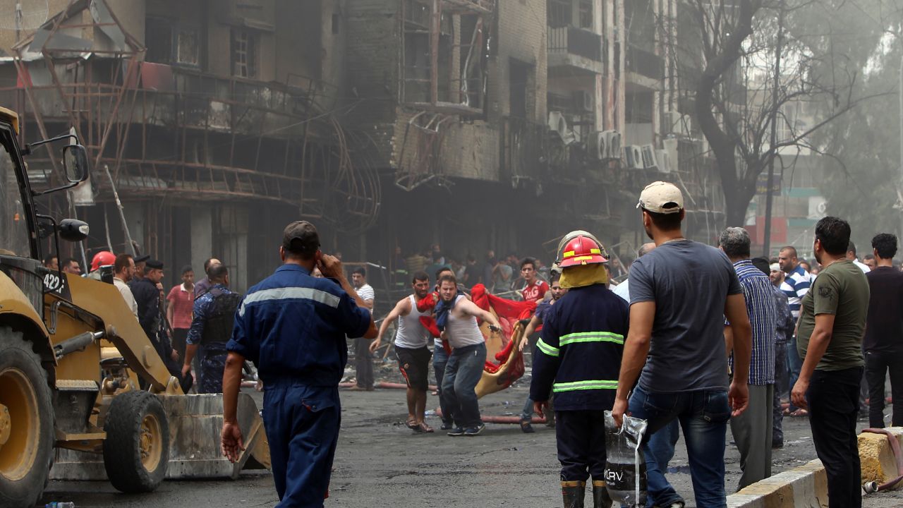 A body is carried away from the site of the blast. 