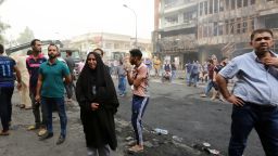 Iraqis react at the site of a suicide car bombing claimed by the Islamic State group on July 3, 2016 in Baghdad's central Karrada district.
The blast, which ripped through a street in the Karrada area where many people go to shop ahead of the holiday marking the end of the Muslim fasting month of Ramadan, killed at least 75 people and also wounded more than 130 people, security and medical officials said. The Islamic State group issued a statement claiming the suicide car bombing, saying it was carried out by an Iraqi as part of the group's "ongoing security operations". / AFP / SABAH ARAR        (Photo credit should read SABAH ARAR/AFP/Getty Images)