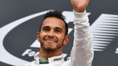Lewis Hamilton celebrates victory on the podium at the Austrian Grand Prix at the Red Bull Ring in Spielberg. 