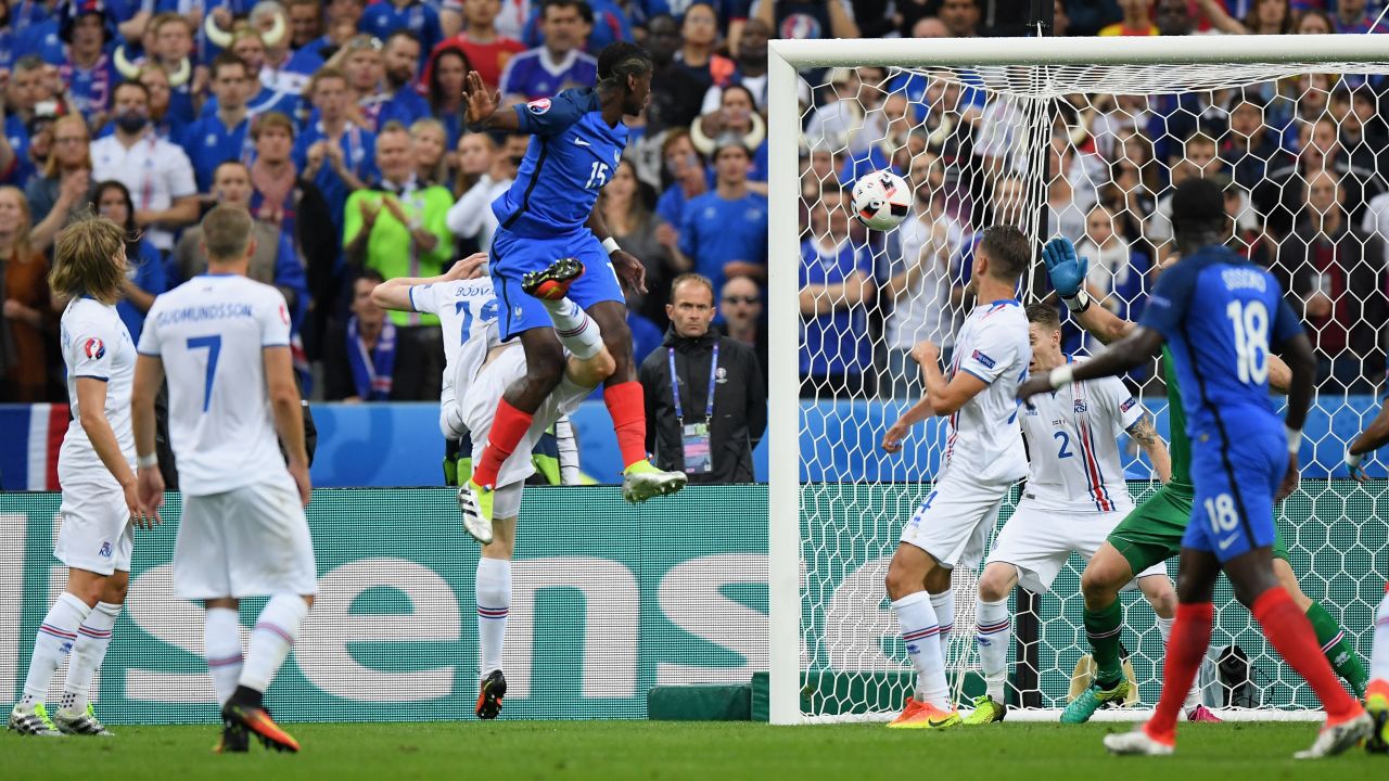 Paul Pogba, fourth from left, of France heads the ball to score his team's second goal.