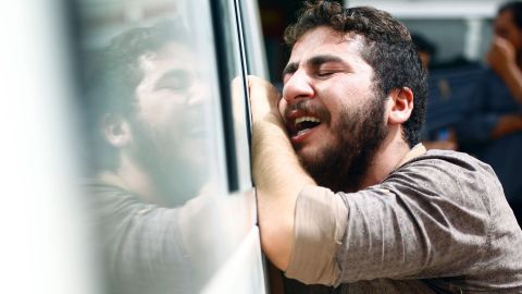 An Iraqi man mourns in the holy Iraqi city of Najaf during the funeral procession for the victims of a suicide bombing.