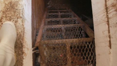 A tug on an escape hatch behind a mirror popped open a doorway to a secret tunnel in Los Mochis.