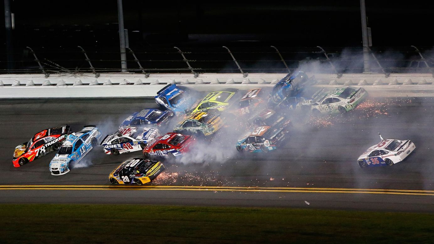 Numerous cars are collected in a wreck during the Sprint Cup race at Daytona on Saturday, July 2.