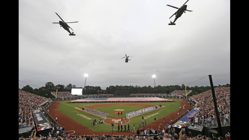 Military helicopters fly over a field at Fort Bragg, North Carolina, prior to <a href="index.php?page=&url=http%3A%2F%2Fwww.cnn.com%2F2016%2F07%2F01%2Fsport%2Fmarlins-braves-at-fort-bragg%2F" target="_blank">a special Major League Baseball game </a>between Miami and Atlanta on Sunday, July 3. The vast majority of seats were reserved for U.S. service members and their families. <a href="index.php?page=&url=http%3A%2F%2Fwww.cnn.com%2F2016%2F06%2F28%2Fsport%2Fgallery%2Fwhat-a-shot-0628%2Findex.html" target="_blank">See 27 amazing sports photos from last week</a>