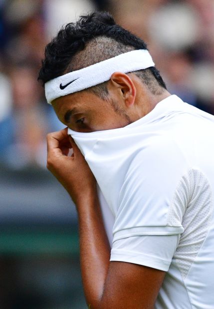 Nick Kyrgios reacts while playing Britain's Andy Murray during their men's singles fourth round match. Australian Kyrgios -- who plays without a coach -- appeared distracted throughout the match. 
