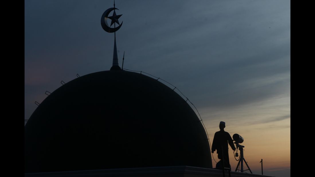Muslims in Jakarta, Indonesia, look for the new crescent moon that determines the end of Ramadan.