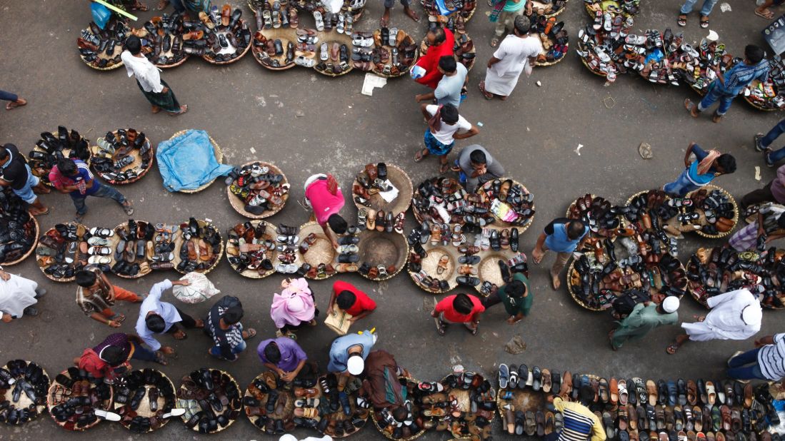 Shoe sellers display their wares in Dhaka, Bangladesh, on Monday, July 4. Traders expect to see good business at the end of Ramadan and the subsequent Eid celebration.