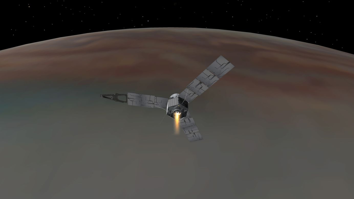 An illustration depicts NASA's Juno spacecraft entering Jupiter's orbit. Juno will study Jupiter from a polar orbit, coming about 3,000 miles (5,000 kilometers) from the cloud tops of the gas giant.