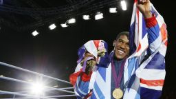 Anthony Joshua of Great Britain celebrates during the awards ceremony for the Super-Heavyweight (+91kg) boxing category of the 2012 London Olympic Games at the ExCel Arena August 12, 2012 in London.   AFP PHOTO / Jack GUEZ        (Photo credit should read JACK GUEZ/AFP/GettyImages)