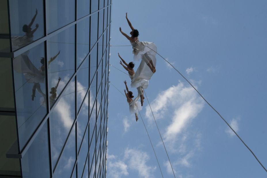The troupe has danced suspended from buildings measuring over 400 feet tall and on mountaintops 2,700 feet above the ground.  <br />