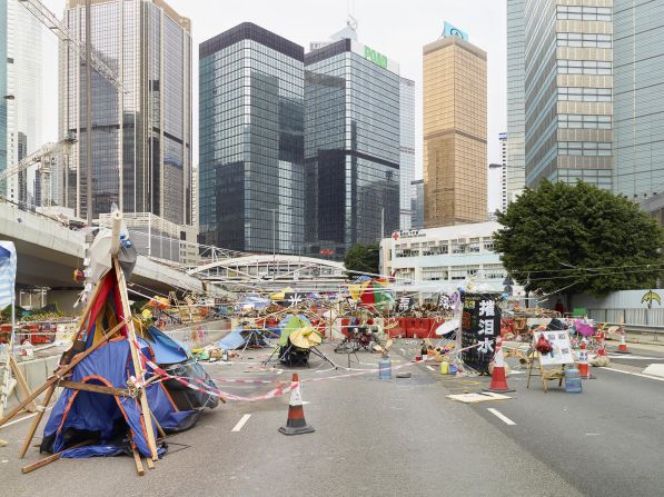 When Hong Kong's massive Occupy protests took over city streets in 2014, Hong Kong photographer Johnny Gin began creating images of demonstrators' homemade barricades as a "vernacular expression of protest culture." For Gin, the structures showed "how adaptive Hong Kong people are, in terms of making the best out of a very bad situation."