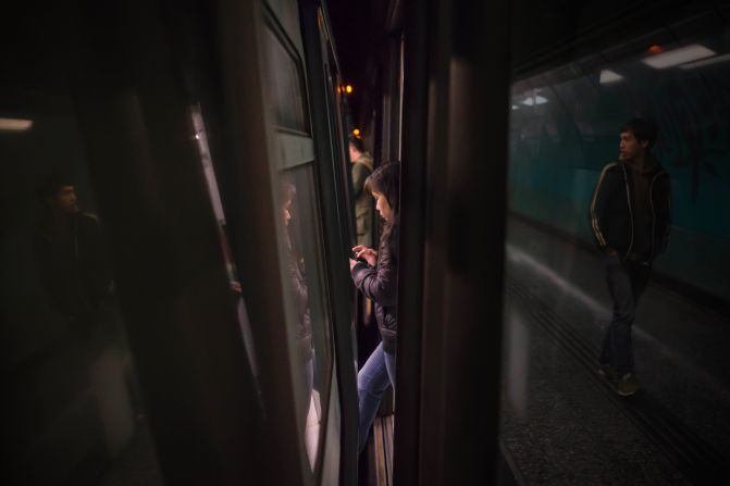 Singapore-based photographer captured passengers as they moved through the narrow gaps between Hong Kong's subway trains and and platform doors. The compilation documents "the hustle and bustle of Hong Kong," Chong says.