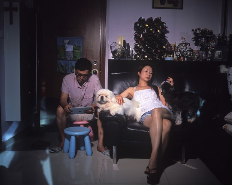 Singapore-based photographer Wei Leng Tay created pictures of Hong Kongers inside their homes to "reach out and see what other people were doing with their lives, and how they were handling the spaces and stresses of living in Hong Kong," she says. "The work helps me make sense of... our personal lives and the multiple roles we play." 
