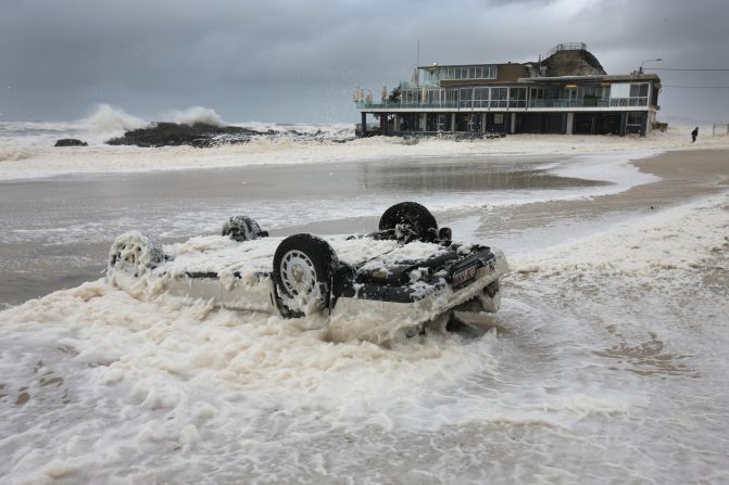 Surf Life Saving Clubs across the nation have to be built to withstand extremes of weather, from searing heat to huge storms. Here, a wave washes over a flipped car near the Currumbin Surf Club building along a stretch of Gold Coast beach in the Australian state of Queensland following a severe storm. 
