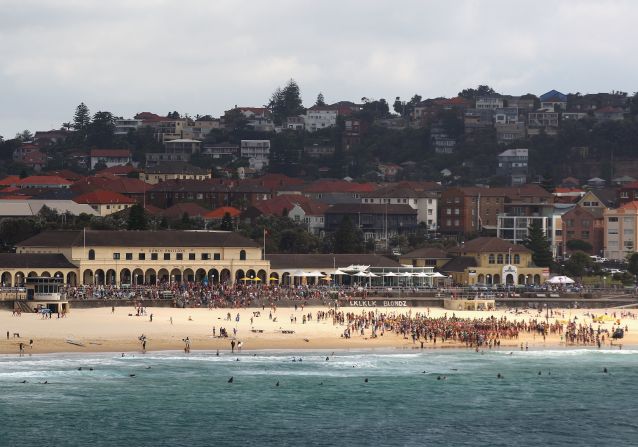 Swimmers prepare to enter the water during the Bondi to Bronte Ocean Swim at Bondi Beach in Sydney, Australia. This annual event is swum over a 2.5 kilometer course between the first two Surf Life Saving clubs in the world. 