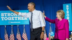 US President Barack Obama and Democratic presidential candidate Hillary Clinton arrive at a campaign event in Charlotte, North Carolina, on July 5, 2016. / AFP / NICHOLAS KAMM        (Photo credit should read NICHOLAS KAMM/AFP/Getty Images)