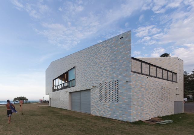 "The building belongs to a landscape -- it is designed in the round. Its pitched roof and cut-away walls produce a sculpted form with a unique appearance on each side, reinforced by color," says project architect, Tamas Jones, from Neeson Murcutt Architects. 