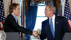 US President George W. Bush shakes hands with British Prime Minister Tony Blair in the Cross Hall of the White House during a press conference 17 July, 2003, in Washington, DC. The Iraq war allies are facing mounting criticism from both their countries over bad intelligence before the war. Blair maintained the accuracy of British intelligence on Iraq's purchase of nuclear material from Niger, saying 'we know for sure' that it bought 270 tons of the material from the African country in the 1980s