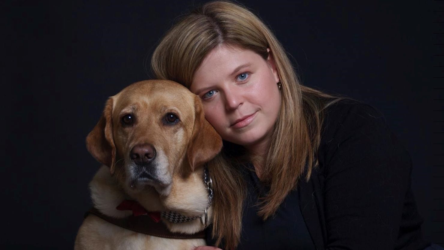 Trafficking survivor and advocate Margeaux Gray with her guide dog, Junebug.