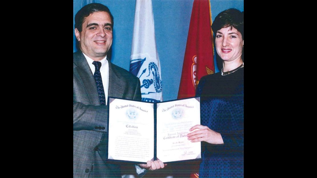 Ana Montes with then-Deputy DCI George Tenet, after receiving an award. 