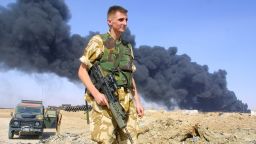 (FILES) This file photo taken on July 29, 2003 shows a British soldier at the scene of a burning oil pipeline, a few kilometres southeast of Basra, Iraq.
The Chilcot inquiry into Britain's role in the Iraq war reports on Wednesday nearly seven years after it was launched. It is expected to deal extensively with the failures in the military operation, from the planning of the war to the occupation, after which Iraq descended into sectarian violence from which it has yet to emerge. / AFP PHOTO / AHMAD AL-RUBAYEAHMAD AL-RUBAYE/AFP/Getty Images