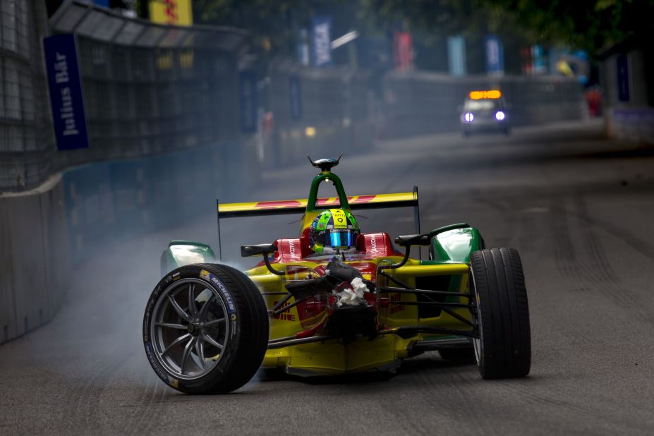 Lucas di Grassi limps back to the pit lane after crashing into the back of Sebastien Buemi in Sunday's final race. The Brazilian ended up two points behind eventual championship winner Buemi.  