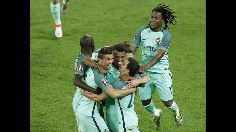 Portuguese players celebrate their second goal, which was scored by Nani in the 53rd minute.