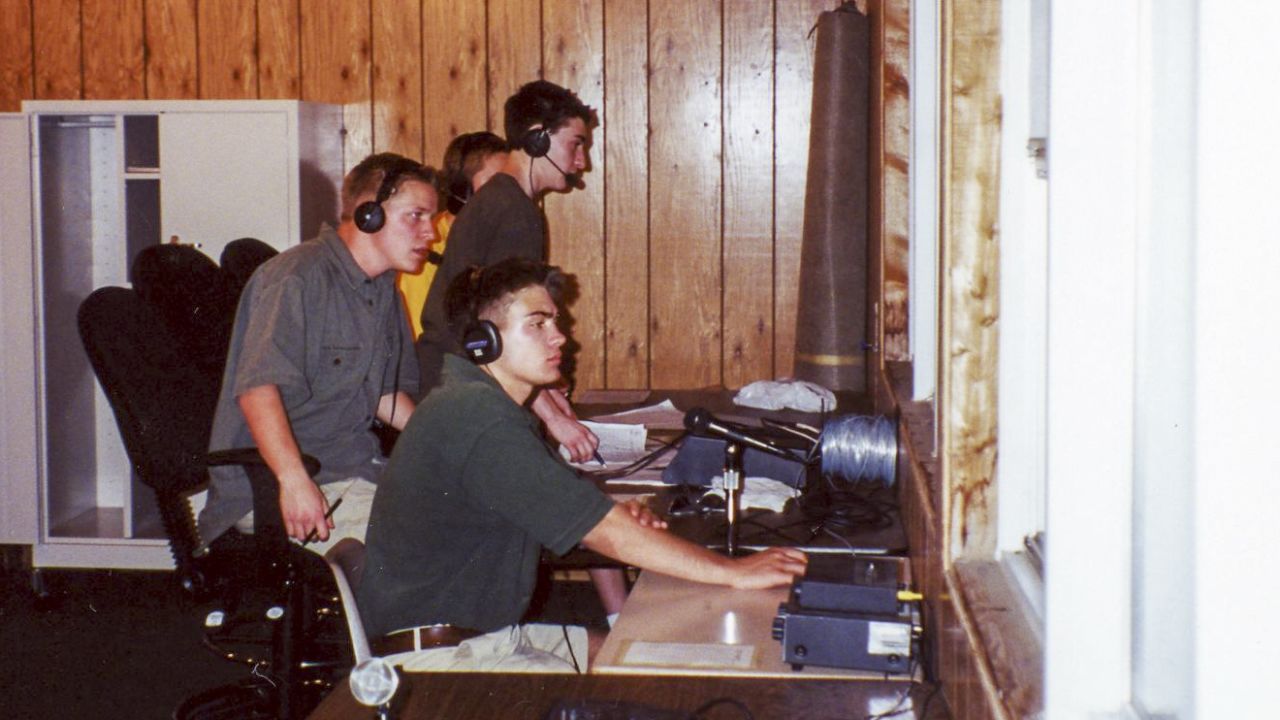 Benetti, standing in front, worked as an announcer for his high school radio station in Homewood, Illinois.