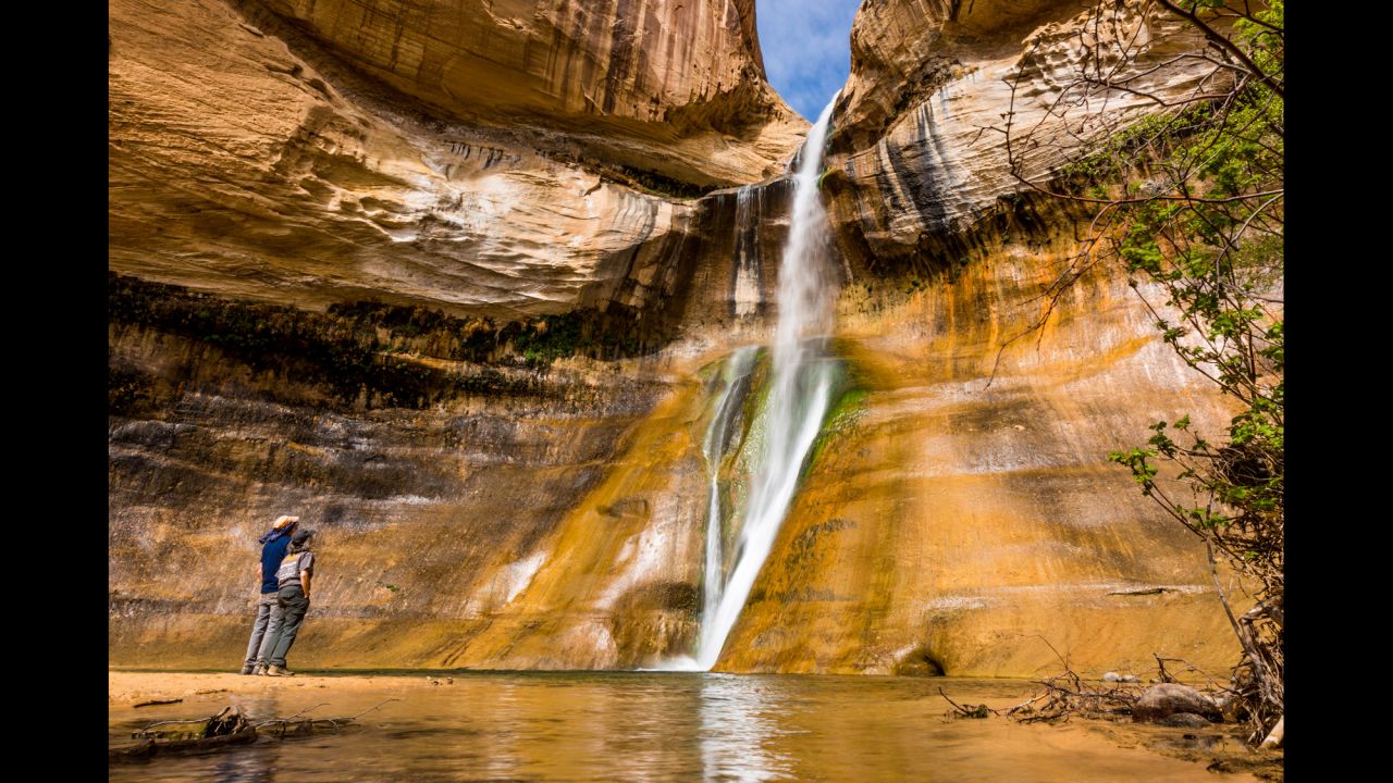 While not in a national park, Calf Creek Falls are about 16 miles east of Escalante, Utah, and about an hour south of Capitol Reef National Park. The six-mile Lower Calf Creek Falls hike is about a three-hour round trip if you spend some time at the waterfall and walk at a comfortable pace.