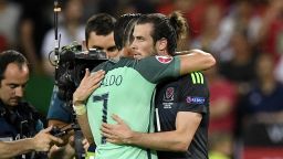 Wales' forward Gareth Bale (R) and Portugal's forward Cristiano Ronaldo embrace at the end of their match in the Euro 2016 semi-final football match between Portugal and Wales at the Parc Olympique Lyonnais stadium in Décines-Charpieu, near Lyon, on July 6, 2016.

Portugal beat Wales 2-0 to go into the finals. / AFP / MARTIN BUREAU        (Photo credit should read MARTIN BUREAU/AFP/Getty Images)