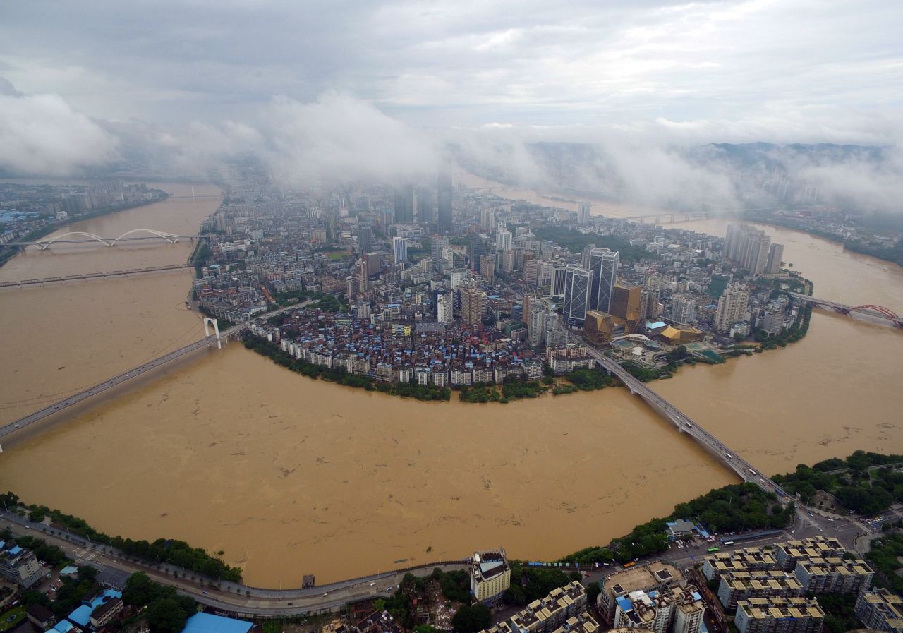 The city of Liuzhou, Guangxi province is surrounded by the swollen Liujiang River July 5. 