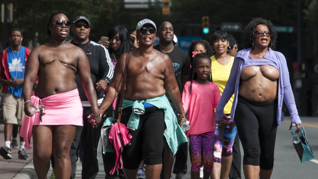 Shameka Fulston, left, and others  join Paulette Leaphart for a community walk in Charlotte. Fulston planned to rejoin Paulette for the last 100 miles of her walk but left Charlotte feeling disenchanted.