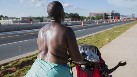 Paulette Leaphart carried no sign and insisted the scars across her chest told her story. She walked along busy roads, like US 29, saying this was how she could be best noticed. 