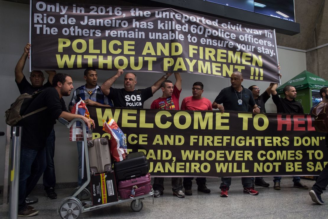 Police and firefighters  protest pay delays this week at Rio de Janeiro's main airport.