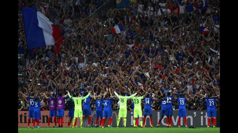 French players celebrate with fans.
