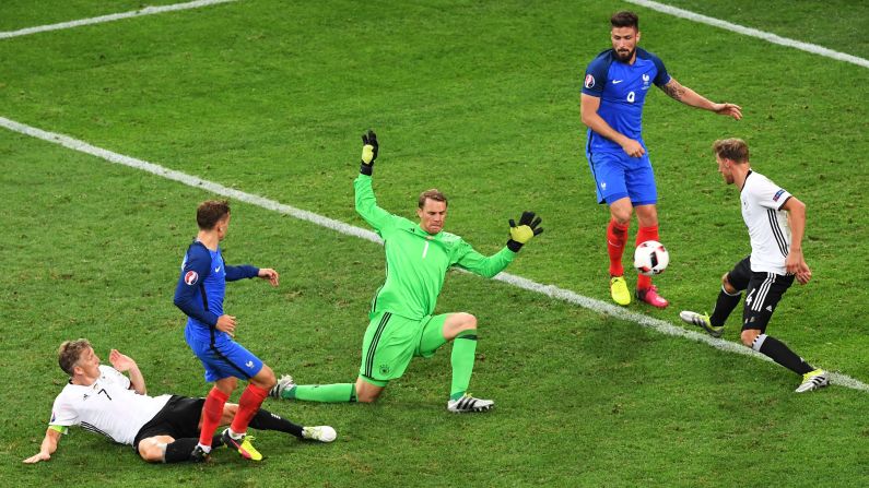 Antoine Griezmann, second from left, scores the second goal of the match. Griezmann had both of France's goals, and he leads the tournament with six goals scored.